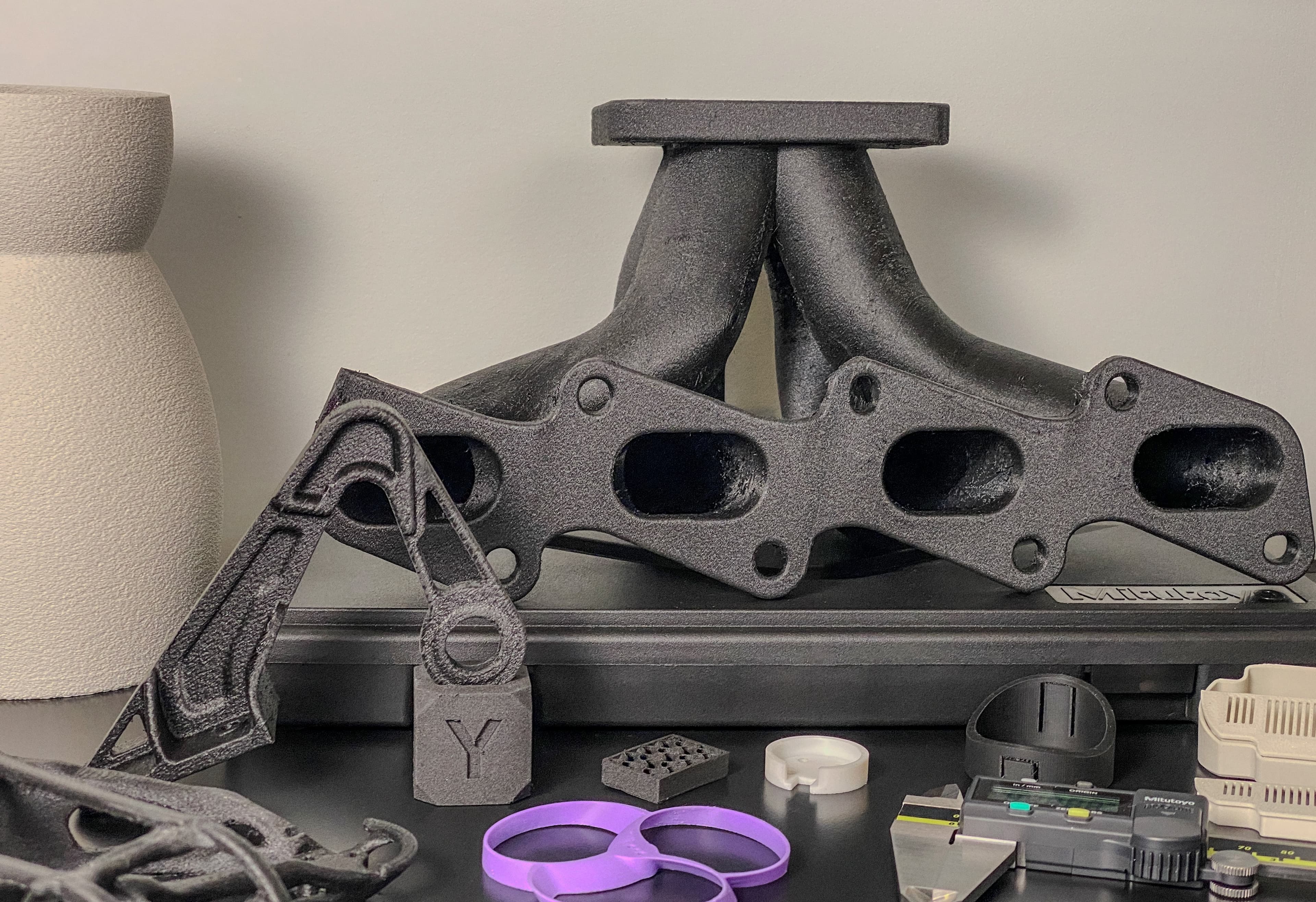 FORM3D 3D printing materials and parts assortment showing precision manufacturing
